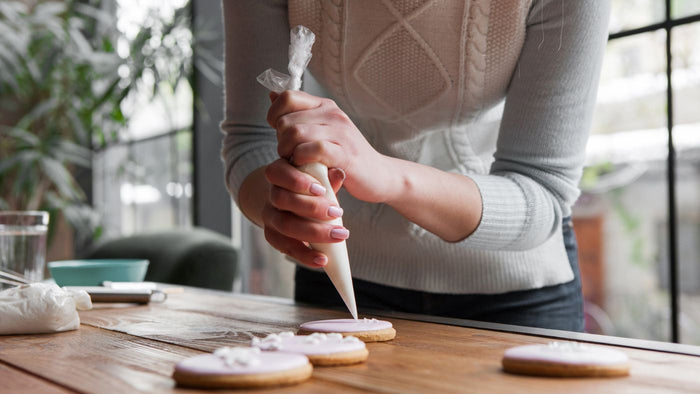 woman decorating treats